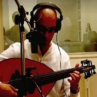 man playing oud